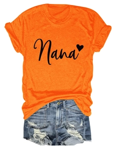 Flat lay of an orange Nana heart t-shirt paired with distressed denim shorts