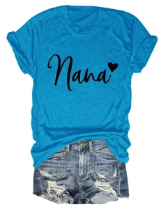 Flat lay of a sky blue Nana heart print T-shirt paired with distressed blue denim shorts