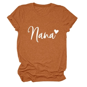 Detail of Nana heart print on soft caramel cotton t-shirt with rolled-up cuffs