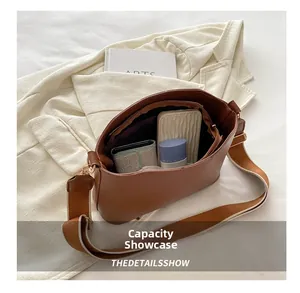 Interior view showing the large capacity and brown leather texture of the shoulder bag