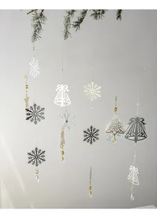 Detail of silver snowflake and bell ornaments with crystal drops for Christmas decor