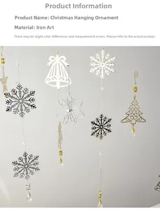 Vertical iron Christmas hanging ornament with snowflake and bell detail on white background