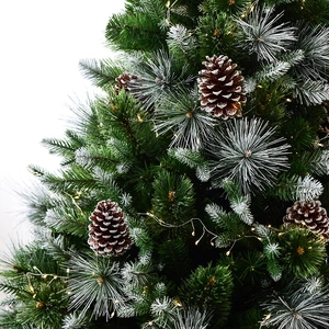 Artificial Christmas tree with frosted pine needles, natural cones and warm LED string lights
