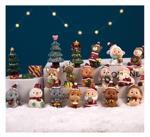 Macro detail of miniature Christmas resin figurines featuring animals and Santa decorations