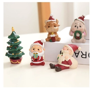 Detailed close-up of 5-piece Christmas resin miniatures set with Santa and holiday trees