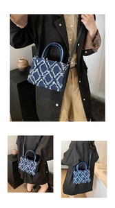 Detail of blue denim crossbody bag featuring frayed quilted texture and gold hardware