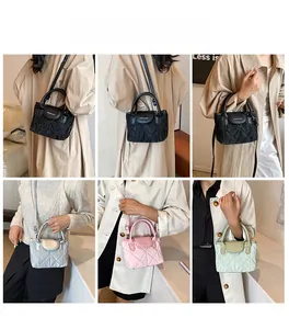 Close-up of quilted fashion bucket bag showing four colors and crossbody strap options