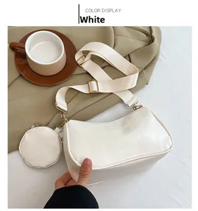 Detailed view of white PU leather crossbody bag with wide strap and mini coin purse pouch