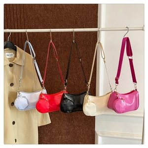 Detail of multi-color crossbody set with matching round coin pouches and nylon straps