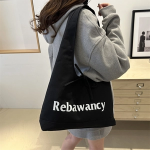 Minimalist black canvas tote bag with Rebawancy print for stylish daily commuting and leisure