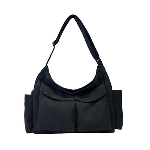 Black canvas utility messenger bag with multi-pockets and adjustable shoulder strap