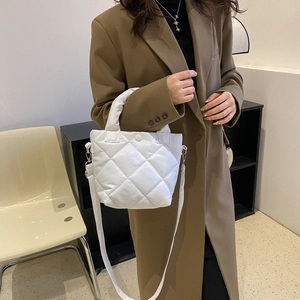 White quilted puffer bucket bag for women with diamond stitching and shoulder strap