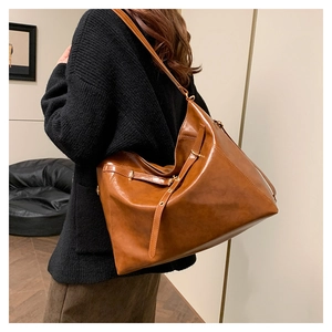 Caramel large capacity tote bag detail with long shoulder straps and pleated PU leather finish