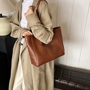 Chic vintage brown PU leather tote bag for women featuring commute style shoulder straps