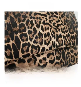 Close-up of the leopard print texture and grainy leather finish on this stylish bag