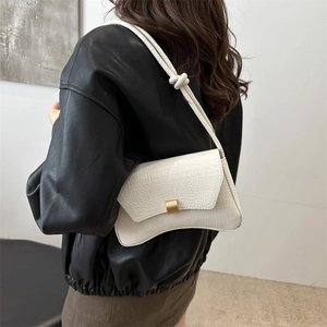 White faux crocodile underarm bag with gold buckle and stylish knot strap detail