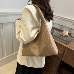 Minimalist woven hobo tote bag in camel leather with Intrecciato style craftsmanship