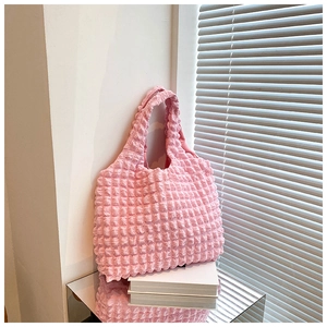 Detailed macro view of pink bubble textured tote bag with high elasticity waffle fabric