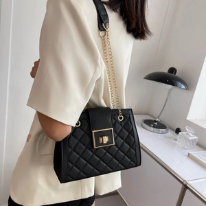 Classic black quilted crossbody bag with golden lock and metal chain strap for women