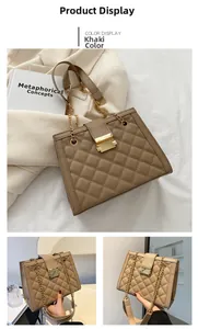 Detailed macro view of khaki quilted leather texture and golden metal chain strap