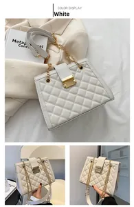 White quilted shoulder bag with gold chain strap and elegant metallic buckle detail
