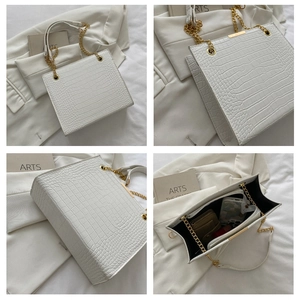 Detailed views of a white crocodile pattern handbag with gold chain straps and interior space