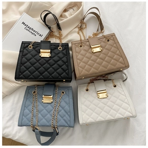 Quilted chain shoulder bags in black, beige, blue, and white with gold metal hardware