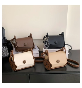 Collection of four vintage solid color crossbody bags in brown, black, white and khaki