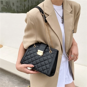Classic black quilted shoulder bag with gold chain strap and elegant metal clasp