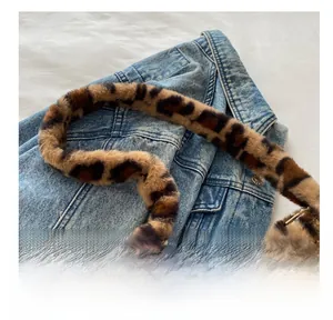 Close-up of the thick leopard print faux fur handle on a stylish winter tote bag