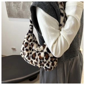 Close-up of leopard print plush tote bag showing soft faux fur texture and pattern