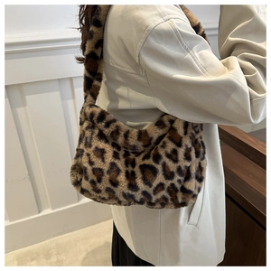 Detail showing plush faux fur leopard print shoulder bag with soft fuzzy texture