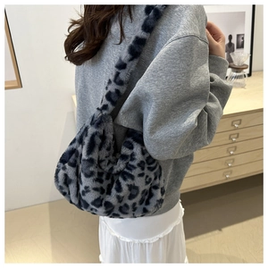 Detail of grey leopard faux fur shoulder bag texture with plush cloud-shaped design