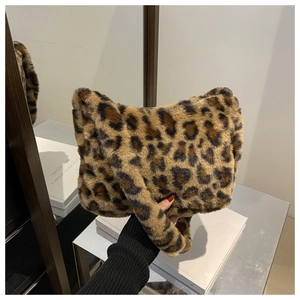 Detail shot of leopard print faux fur shoulder bag with soft plush texture and wide handle