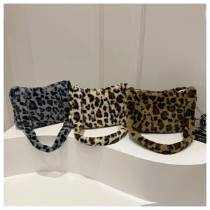 Detailed comparison of three plush leopard print shoulder bags in blue, beige, and brown