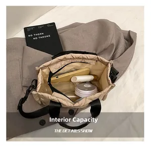 Detail view of beige quilted tote bag showing large interior capacity for daily essentials