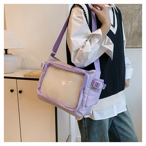 Detail view of a lavender nylon tote bag with a clear mesh pocket for accessories