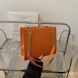 Vintage orange crocodile pattern tote bag with gold chain strap for stylish women