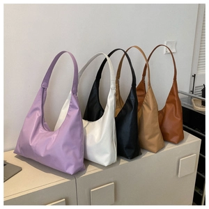 Minimalist half-moon hobo bags shown in purple, white, black, beige, and caramel colors