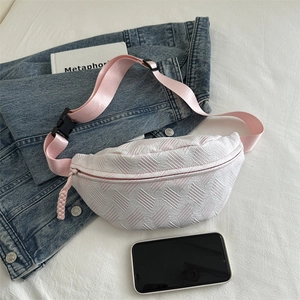 Light pink textured stripe waist bag for women with nylon strap on white fabric background