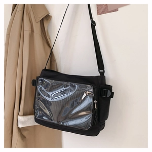 Detail of black ita bag with large transparent window and adjustable crossbody strap