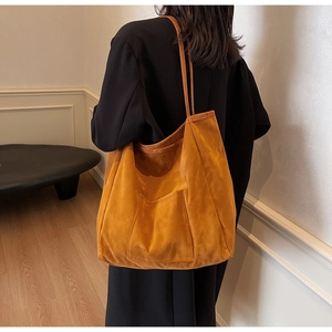 Retro caramel brown matte leather tote bag with a large front pocket for women