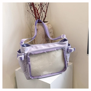 Detail of lavender casual tote with transparent zipper pocket and side resin buckles