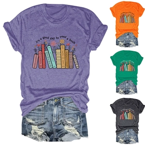 Detail view of colorful women's graphic t-shirts with floral and book themed design