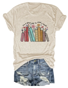Flat lay of beige t-shirt with book and floral print paired with denim shorts