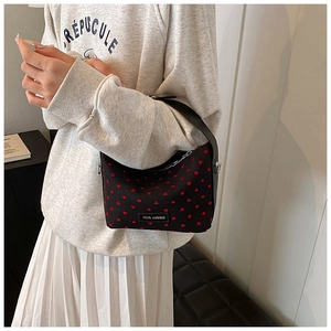 Women fashion casual small handbag with red heart pattern and shoulder strap stylish.