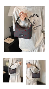 Detail of grey mini canvas tote bag with red polka dots and rich rabbit logo