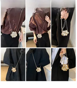 Detailed views of gold-plated acrylic flower shape evening bag with thin chain strap