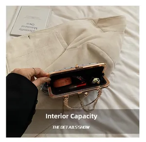 Interior view of grey textured vintage shell bag showing space for lipstick and makeup