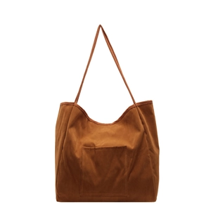 Minimalist caramel brown suede tote bag with front pocket for stylish daily commute